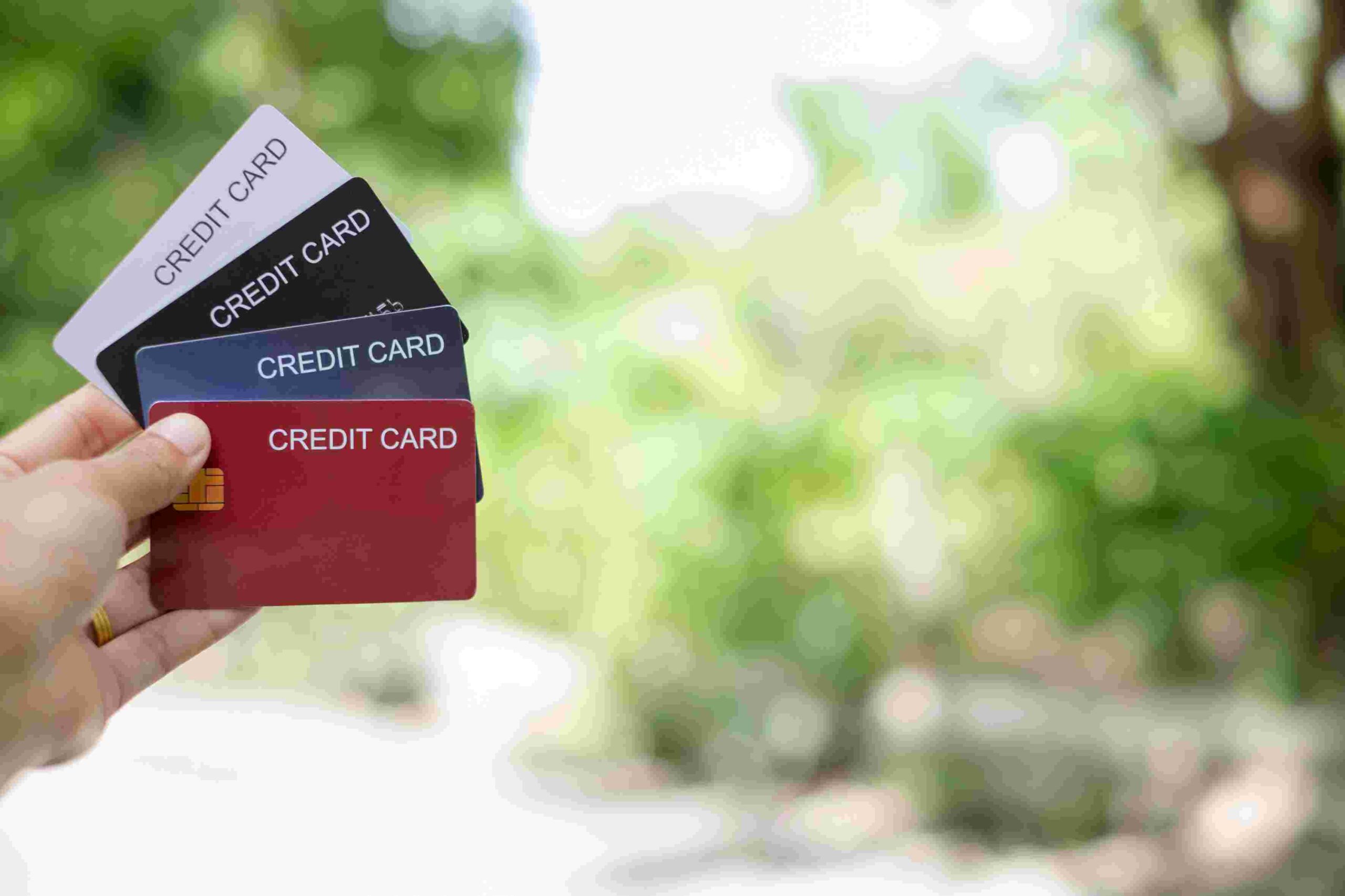 compressed_credit-card-hand-holding-credit-card-with-green-n-2023-11-27-05-18-12-utc