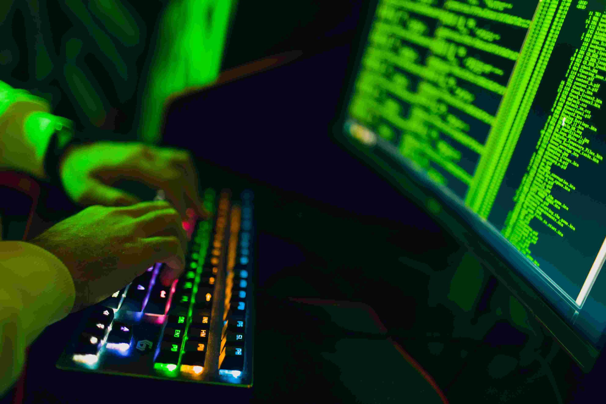 compressed_hacker-in-hoodie-working-hacks-code-site-on-person-2023-11-27-05-26-45-utc