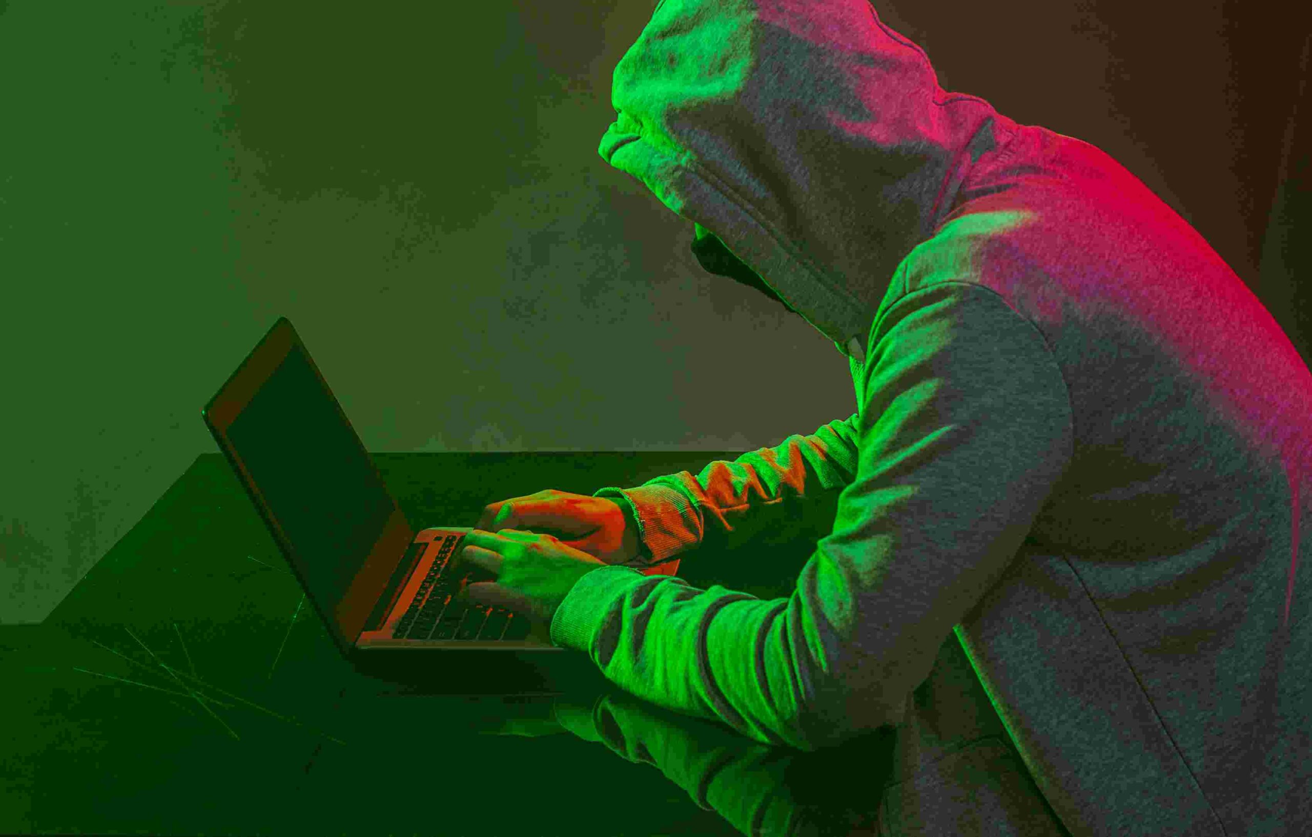 compressed_hooded-computer-hacker-stealing-information-with-l-2024-10-23-10-44-33-utc